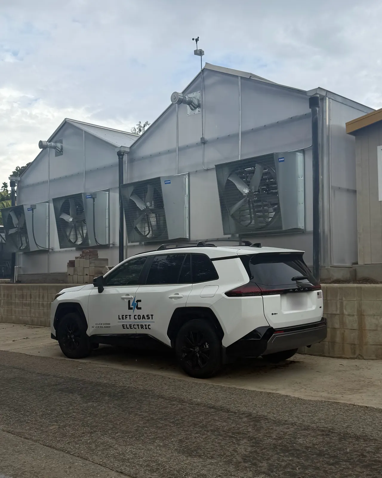 Left Coast Electric vehicle parked at a greenhouse with large exhaust fans at the LA County Arboretum, Arcadia