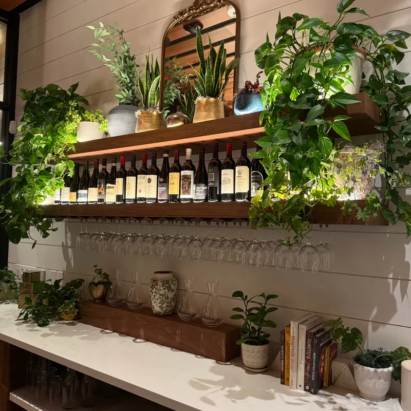 Wine shelf with under-shelf lighting at North Italia Brea