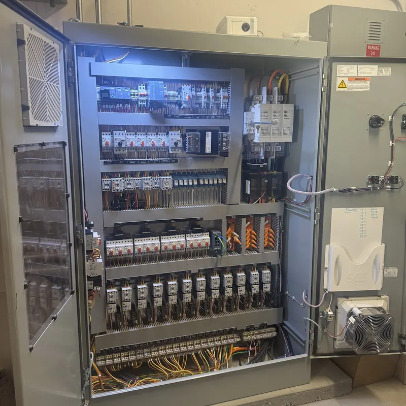 Open car wash equipment control panel with motor starters and terminal wiring at Quick Quack Car Wash in Upland, CA